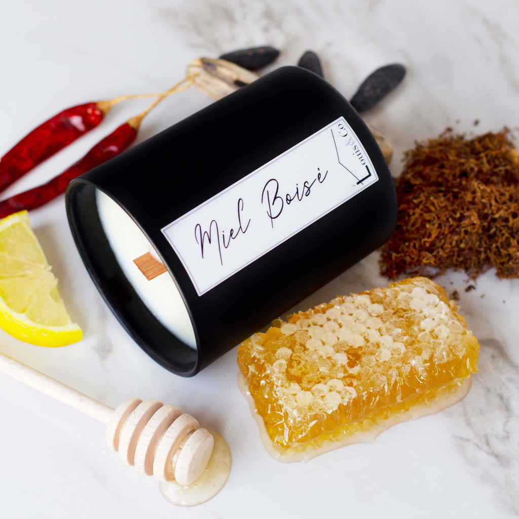 Miel Boisé (translating to Woody Honey) is one of our most complex and interesting fragrances! It is also our most "neutral" scent, so highly recommended for a gift. Think... a dark and powerful blend of tobacco leaf, softened with honey accords. Sweet and woody, yet pleasant and clean. The wooden crackling wick only adds to the experience!